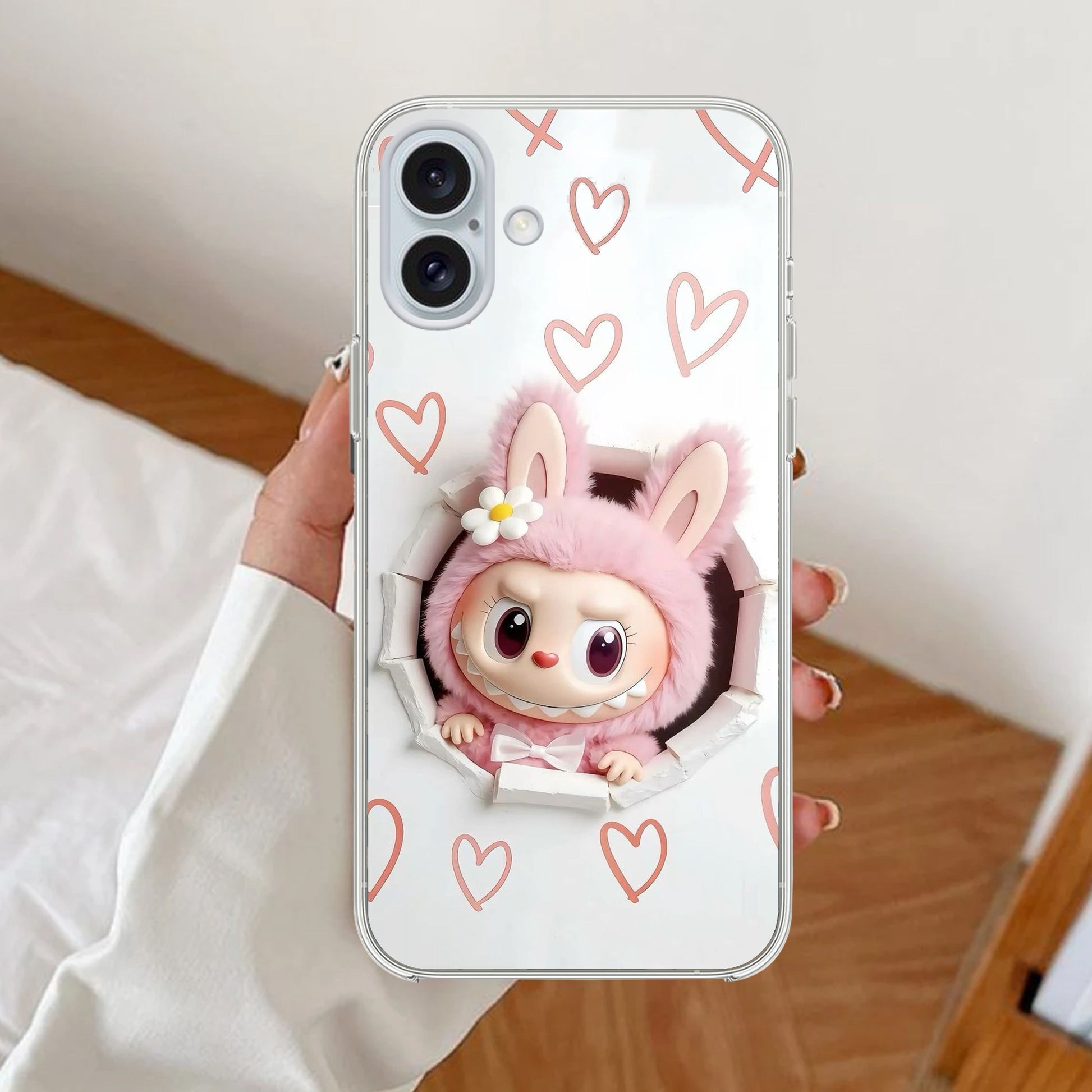 Phone case with butterfly design held by a person