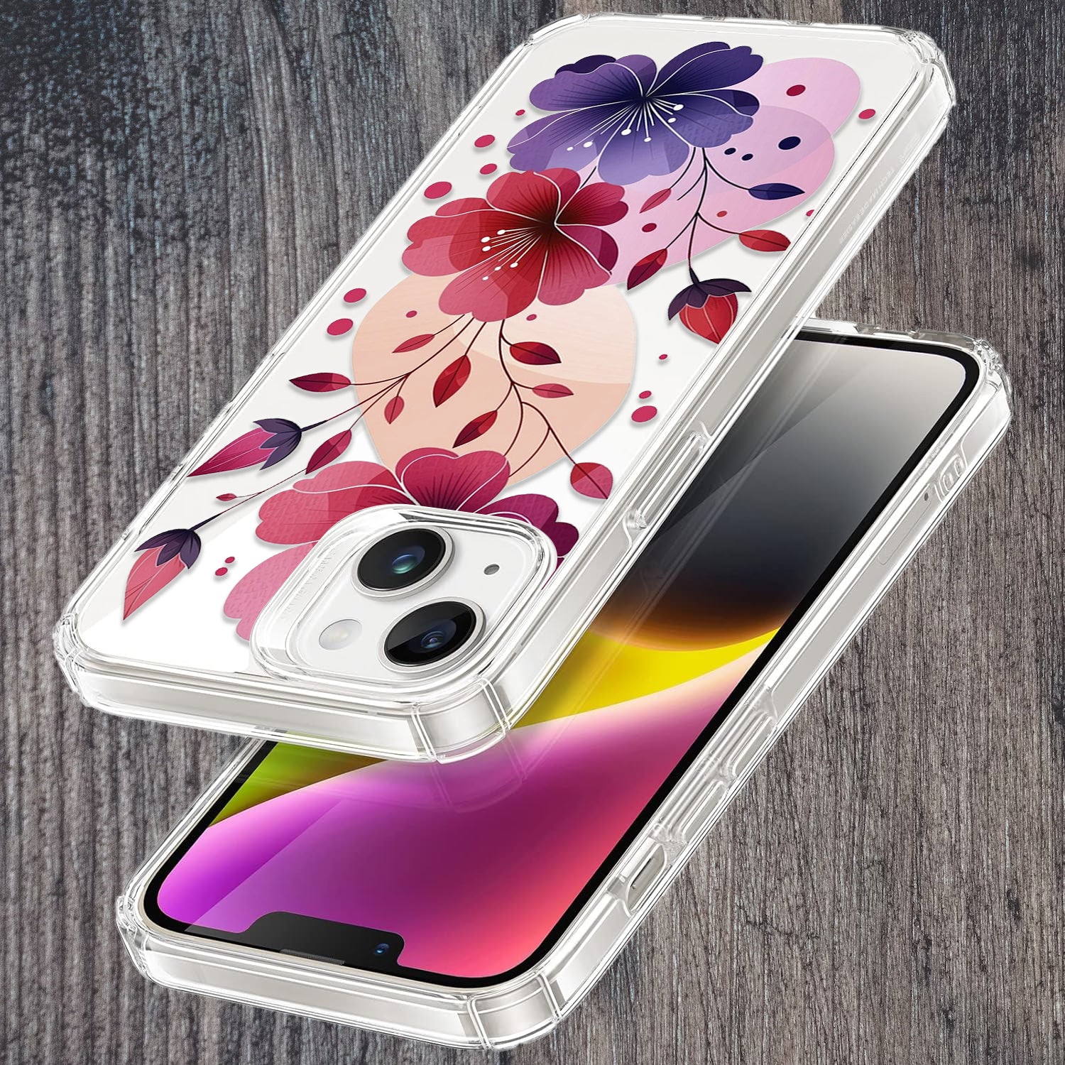 Hand holding a floral phone case next to an open book on a table.